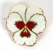 An enamelled pansy brooch, the white, red and yellow enamelled brooch, with flat gilt metal back