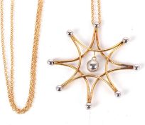 A 9ct necklace, the stylised star shape yellow metal wirework pendant with white metal