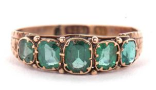 A 15ct emerald ring, the five graduated mixed cut emeralds, 5.5mm wide, collet mounted with bead