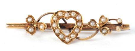 A 15ct seed pearl bar brooch, set with a central seed pearl heart with sprigs of seed pearl set