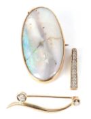 Two gemset pendants and a brooch, the oval opal pendant, collet mounted, stamped 9ct, with tapered