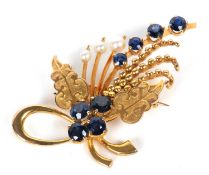 A 9ct sapphire and cultured pearl brooch, the spray style brooch set with eight various sized