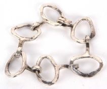 A Danish silver plated bracelet by Jacob Hull, the uneven textured oval links with integrated hook