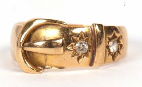 An early 20th century 18ct buckle ring, the 8mm wide band modelled as a buckle set with a diamond