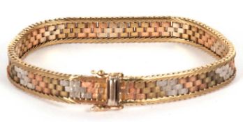 A 9ct tri-colour gold bracelet, the 8.5mm wide brick link style bracelet in yellow, white and rose