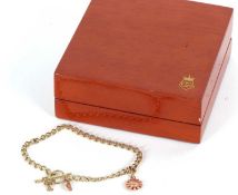 A 9ct Clogau gold charm bracelet, the curblink style bracelet with a rose gold daisy charm with