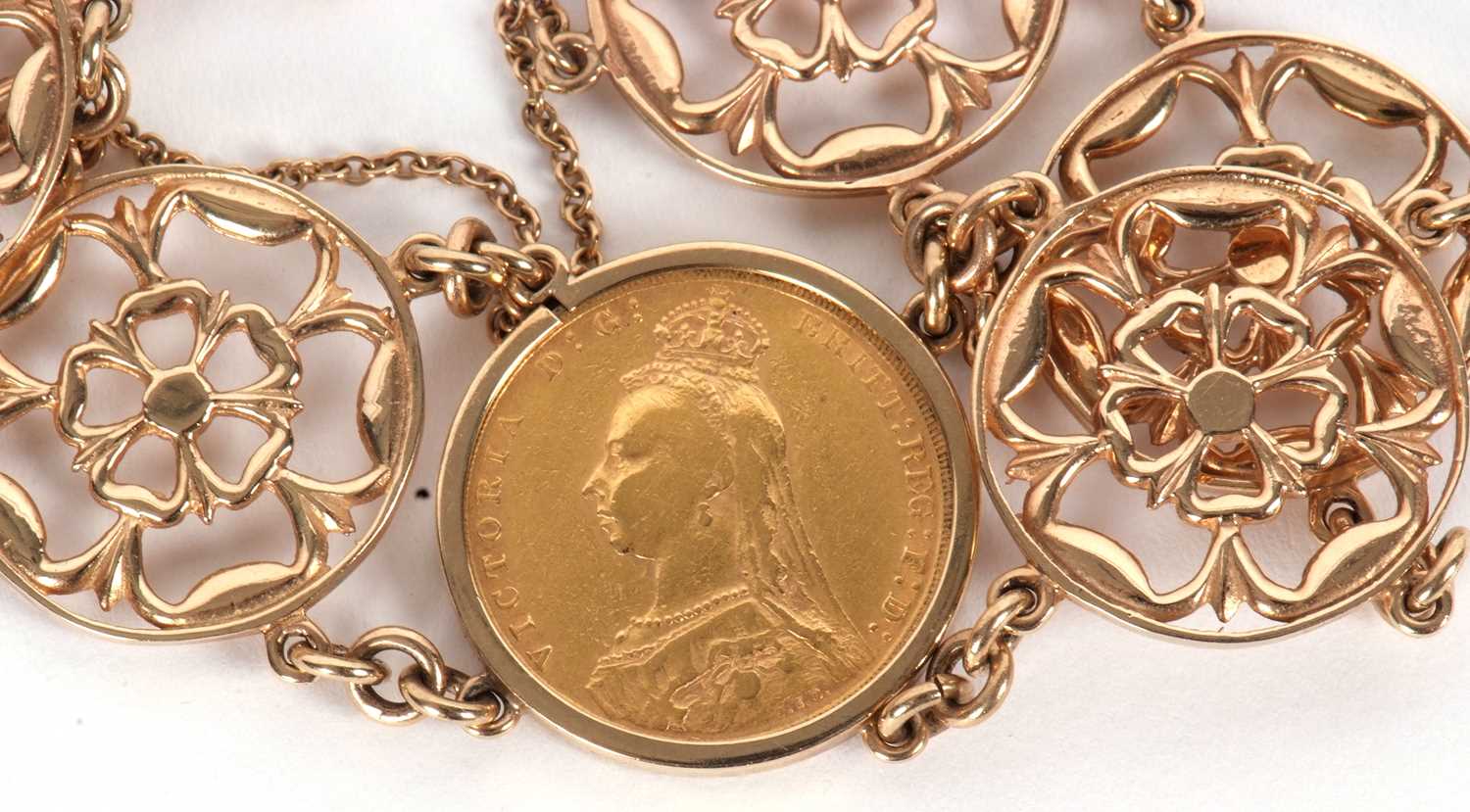 A 9ct mounted sovereign bracelet, the 1889 sovereign in mount stamped 375 (other marks worn), set to - Image 3 of 4