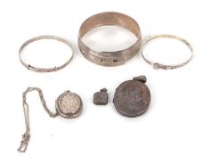A group of unmarked white metal jewellery, to include a buckle bangle, two adjustable bangles, and