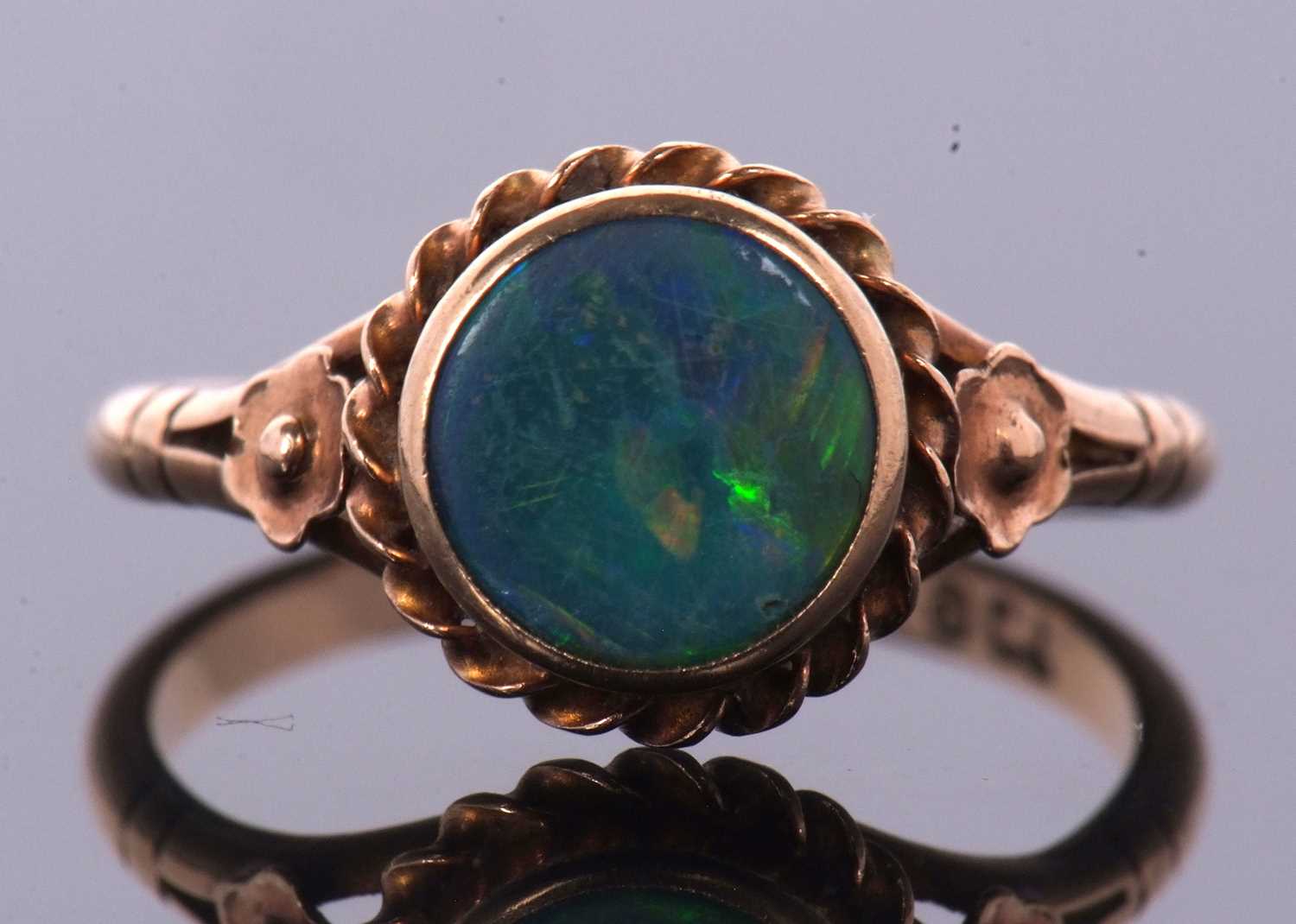 A 9ct opal ring,the round opal cabochon, collet mounted with rope twist border and closed back, 10. - Image 8 of 11