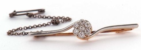 An early 20th century diamond cluster bar brooch, the flowerhead cluster set with old cut diamonds