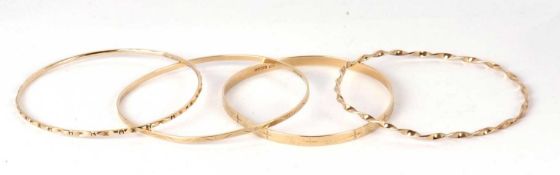 Four 9ct bangles, to include a twisted bangle and three others, all approx. 6.5cm diameter, 23.0g