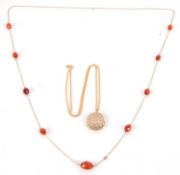 Two neckalces, to include a faceted amber bead necklace on yellow metal chain with fixed tag stamped