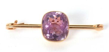 An amethyst bar brooch, the mixed cut cushion shaped amethyst, approx. 13.9 x 12.5mm, collet mounted