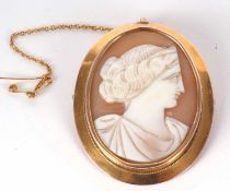 A 9ct mounted cameo, the oval shell cameo of a classical styled lady, collet mounted with fine