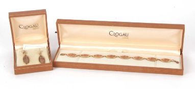 A 9ct two tone Clogau bracelet and matching earrings, comprised of oval discs of yellow and rose