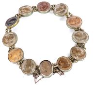 A lava cameo bracelet, the oval lava cameos in white metal collet mounts, each approx. 12mm wide,