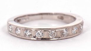 An 18ct diamond ring, the upper half set with round brilliant cut diamonds, with plain lower half