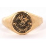 An 18ct signet ring, with crest and inscription, with tapered shoulders and plain band hallmarked