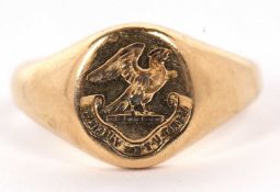 An 18ct signet ring, with crest and inscription, with tapered shoulders and plain band hallmarked