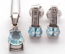 An aquamarine and diamond pendant and similar earrings, the pear shaped aquamarine, claw mounted
