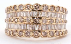A 14ct diamond ring, the wide tapering band set with a row of small round brilliant cut diamonds,