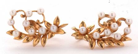 A pair of 9ct cultured pearl earclips, the curved foliate style earrings set with nine small