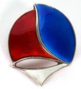 A Norweigan silver and enamel brooch by David Andersen, the red, white and blue enamelled stylised