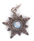 A Charles Horner silver pendant, the star shape pendant, 17mm wide, with faux opal to centre, with