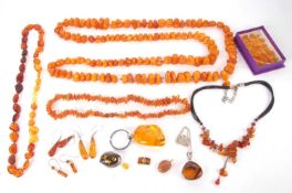 A mixed lot of amber jewellery to include a butterscotch amber bead necklace, 157g, together with