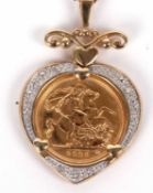 A half sovereign necklace, the 2003 half sovereign in a heart shape mount of white and yellow