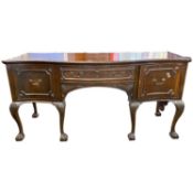 Large Georgian Revival mahogany sideboard of serpentine form with single drawer and two doors raised