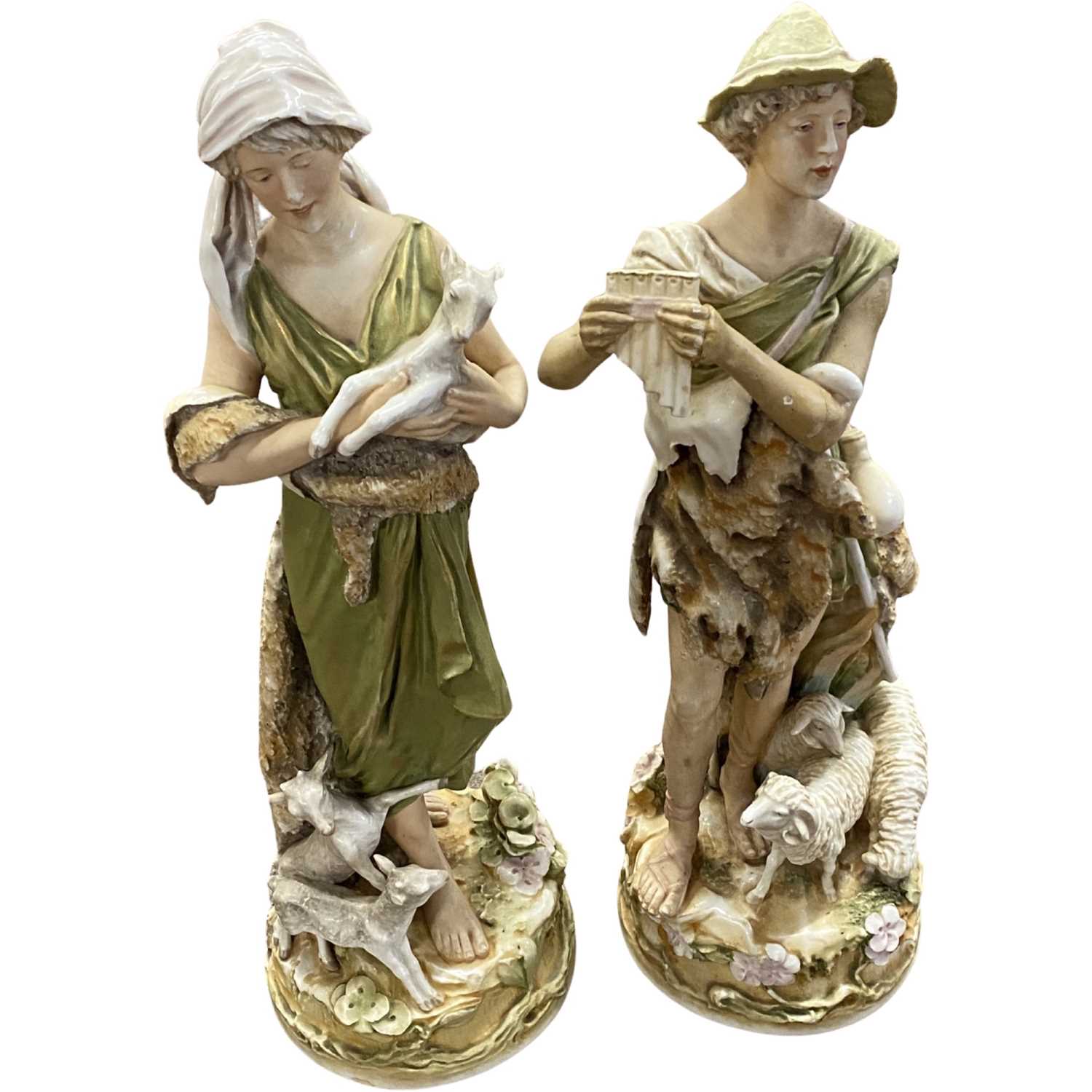 A pair of early 20th Century Royal Dux vases of a Shepherd and Shepherdess, 47cm high (some damage)