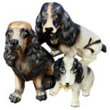 Three ceramic models of dogs, Spaniels and others, largest 43cm high