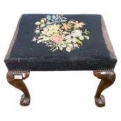 A Georgian style stool of rectangular form with tapestry top raised on cabriole legs with ball and
