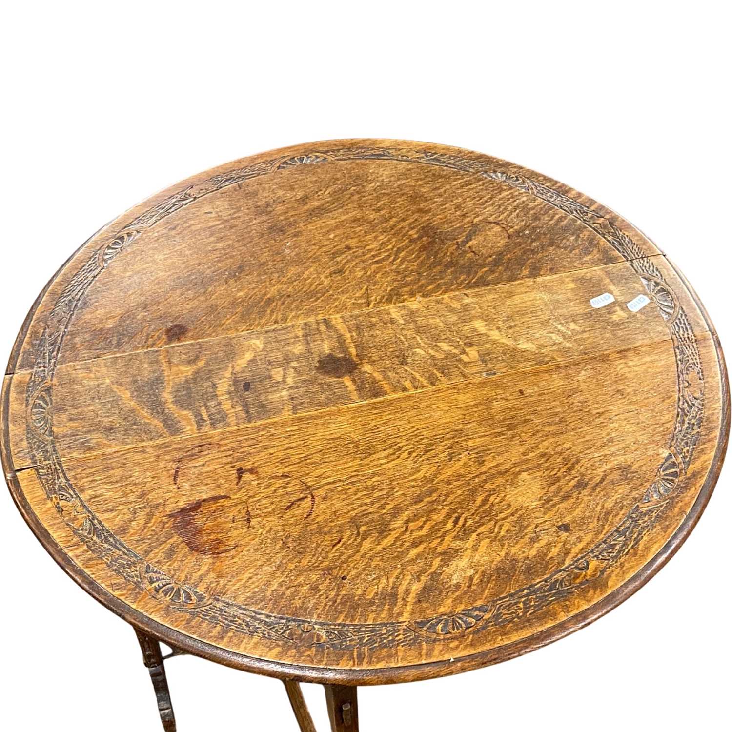 A late 19th Century Arts & Crafts style oak drop leaf occasional table of oval form with pierced - Image 4 of 4