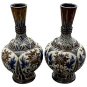 A pair of Doulton vases with incised floral designs, 20cm high