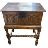 An 18th Century oak Bible box of hinged rectangular form, 60cm wide set on a later bobbin turned