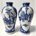 A pair of small Chinese porcelain vases in Qing Shi style with panels decorated with precious