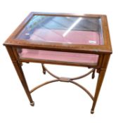 An Edwardian mahogany framed bijouterie table with tapering legs and X formed stretcher, 59cm wide