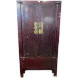 Antique Chinese stained elm wardrobe with two panelled doors opening to two internal drawers and a