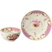 Lowestoft porcelain tea bowl and saucer with polychrome design of a cornucopia and flowers