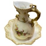 A Royal Worcester blush ground jug of lobed form with floral decoration together with a Doulton
