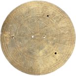 A circular metal sun dial plate, 16cm diameter