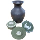 A Wedgwood basalt black baluster vase together with two green jasper ware items and a further