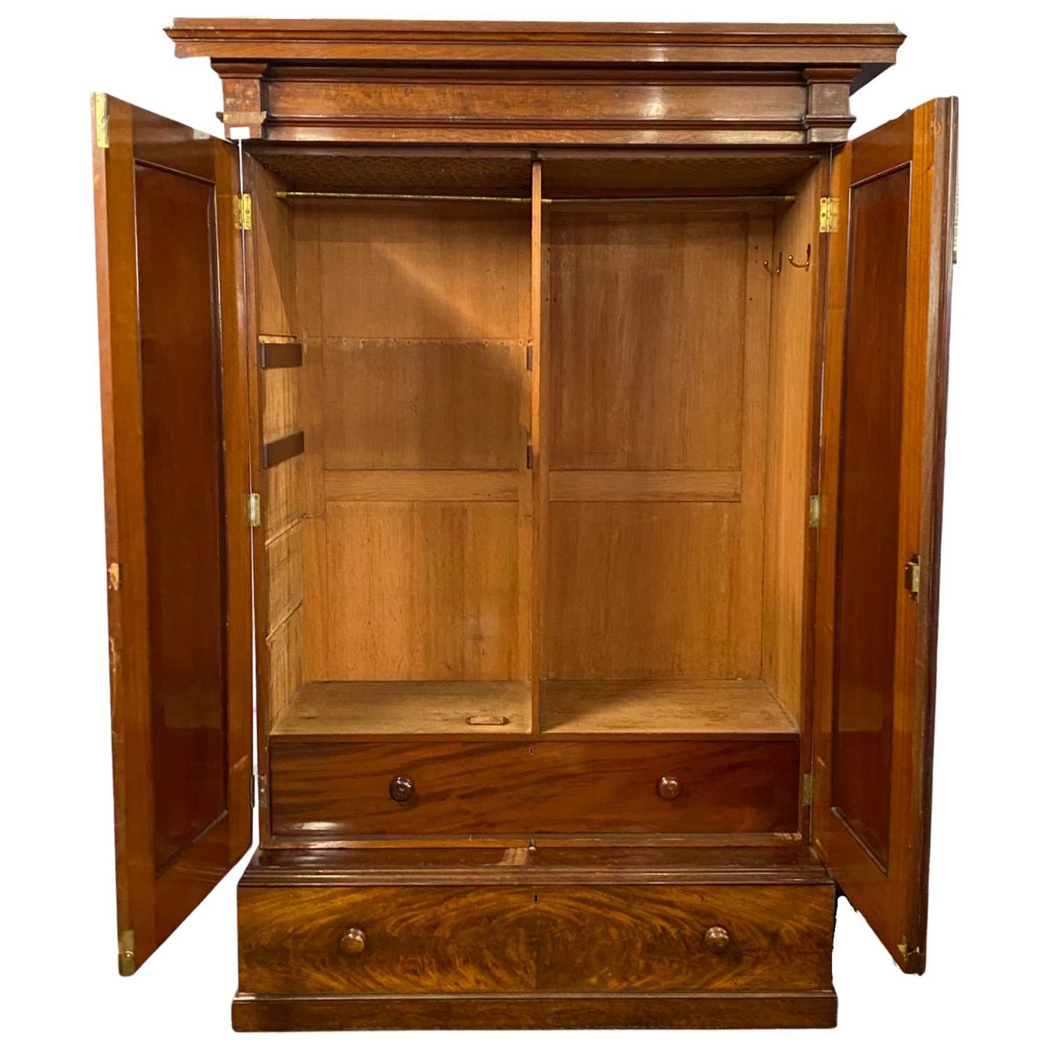 A large Victorian mahogany wardrobe with architectural cornice over two panelled doors and a base, - Image 2 of 2
