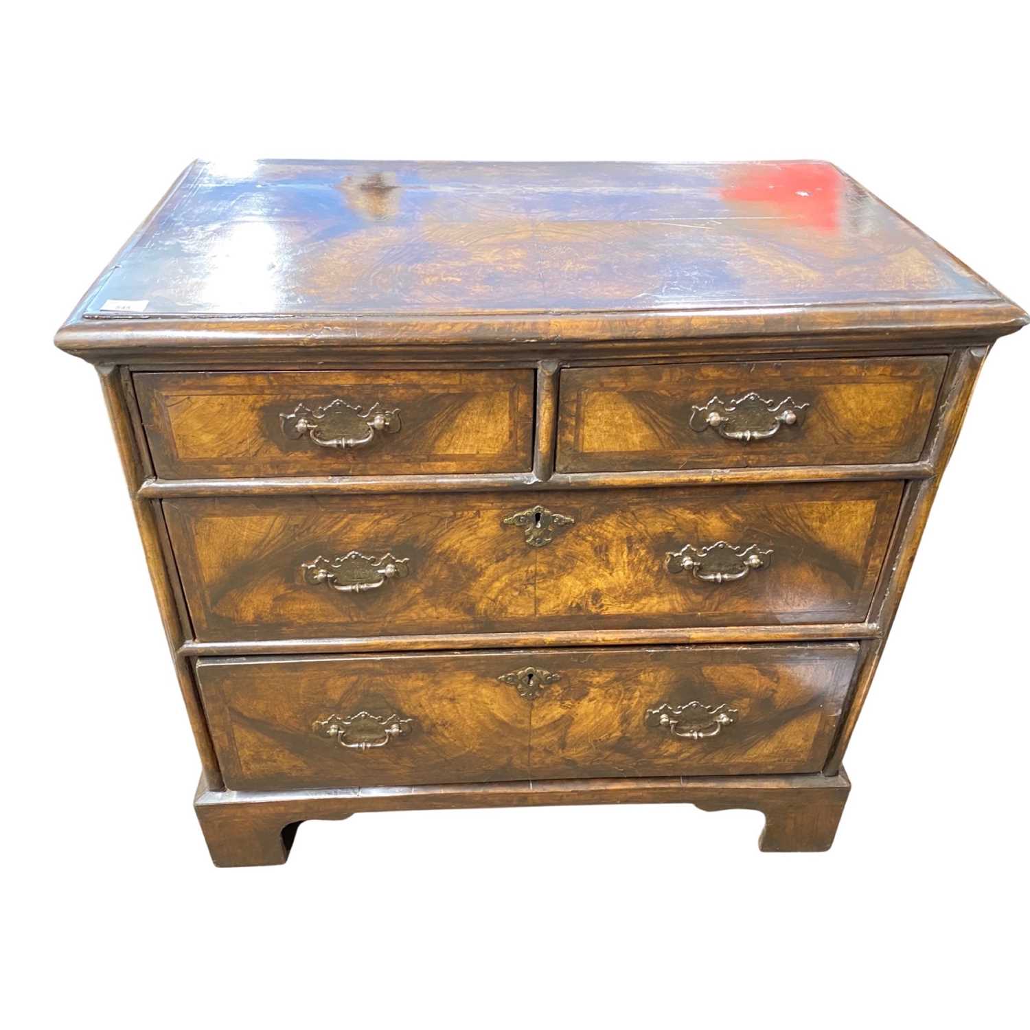 A 18th Century and later chest with two short and two long drawers, finished with walnut and cross - Image 2 of 3