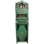 Rowe, New York, USA, a vintage cigarette dispensing machine in floor standing green and black