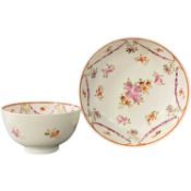 Lowestoft porcelain tea bowl and saucer with floral design
