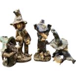 Group of pottery models of gnomes, largest 38cm high