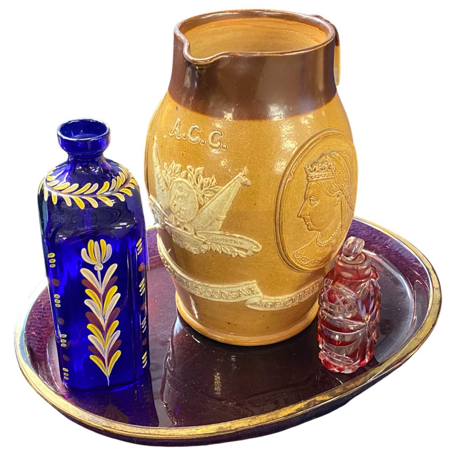 A Doulton commemorative Victoria jug together with a small glass scent bottle with ruby flashing and